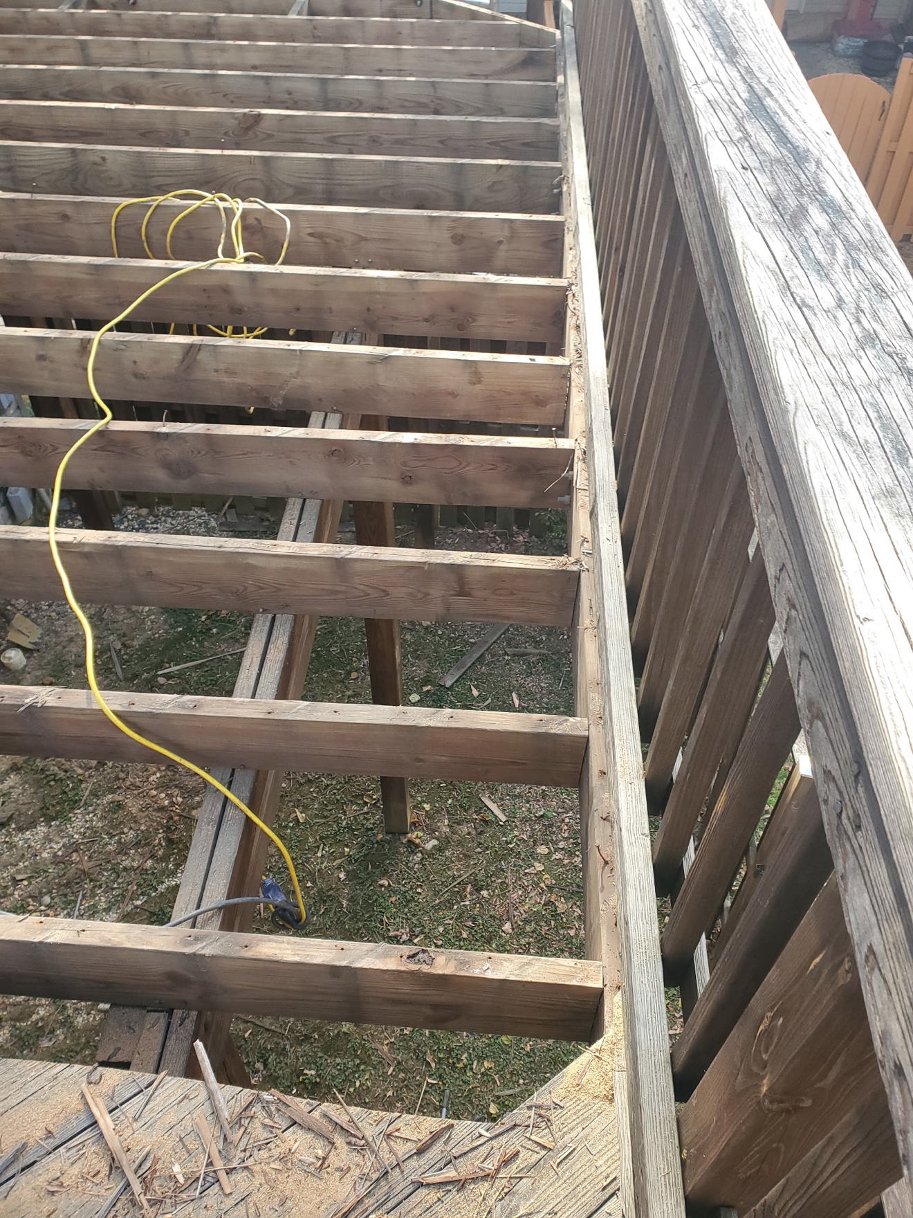 Deck stripped to exposed joists during Francisco's rebuild
