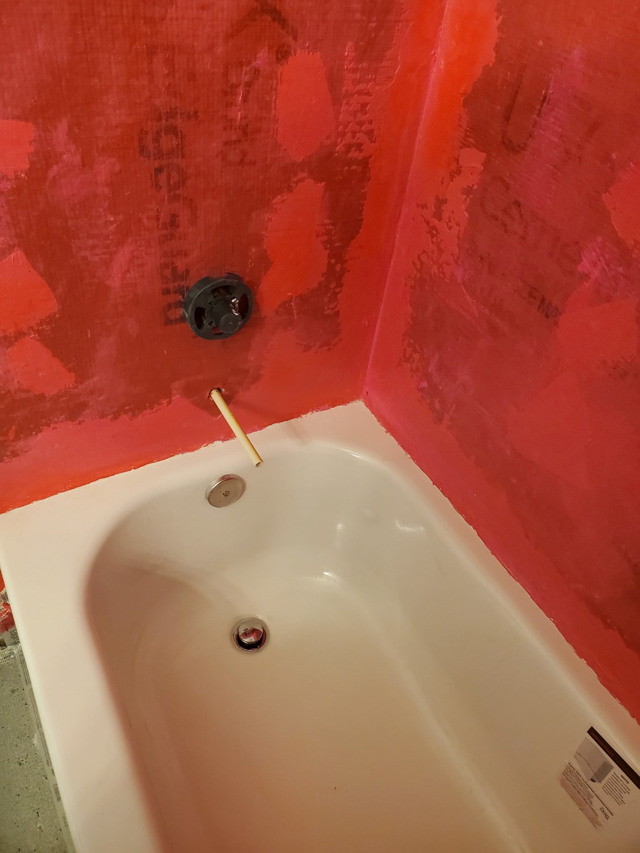 Shower waterproofing membrane being installed