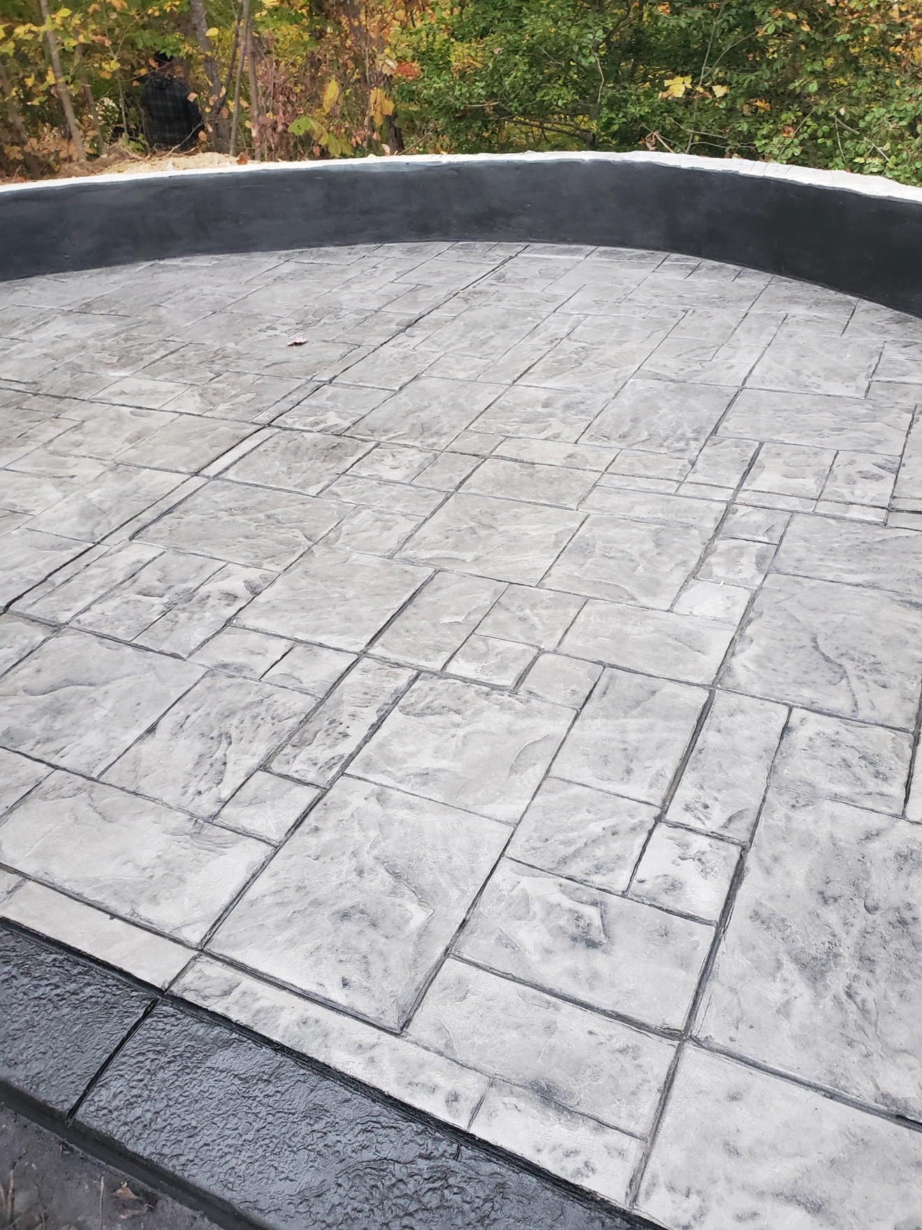 Finished stamped concrete patio with an ashlar slate pattern
