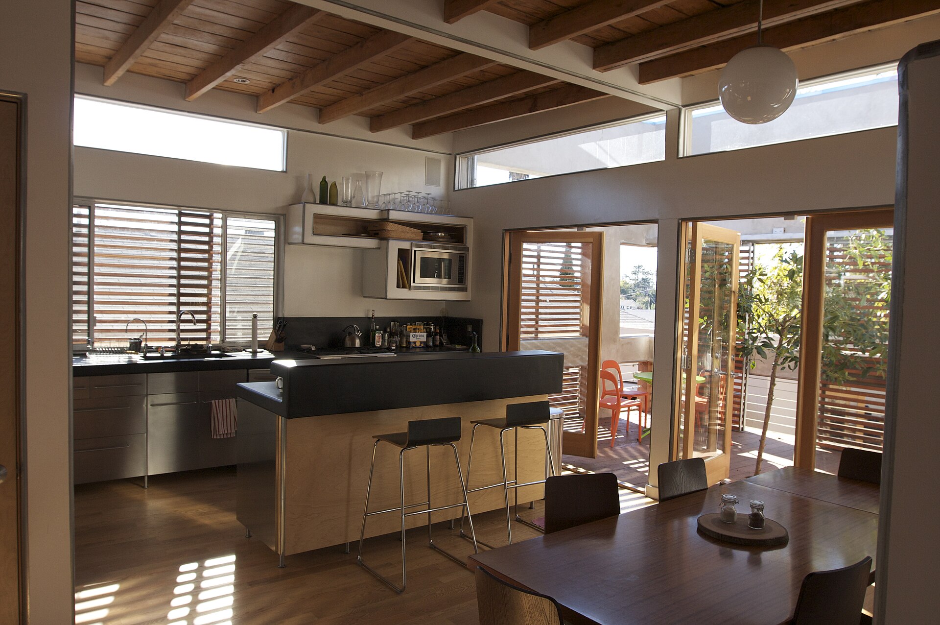 Bright remodeled kitchen with an island and wood beams